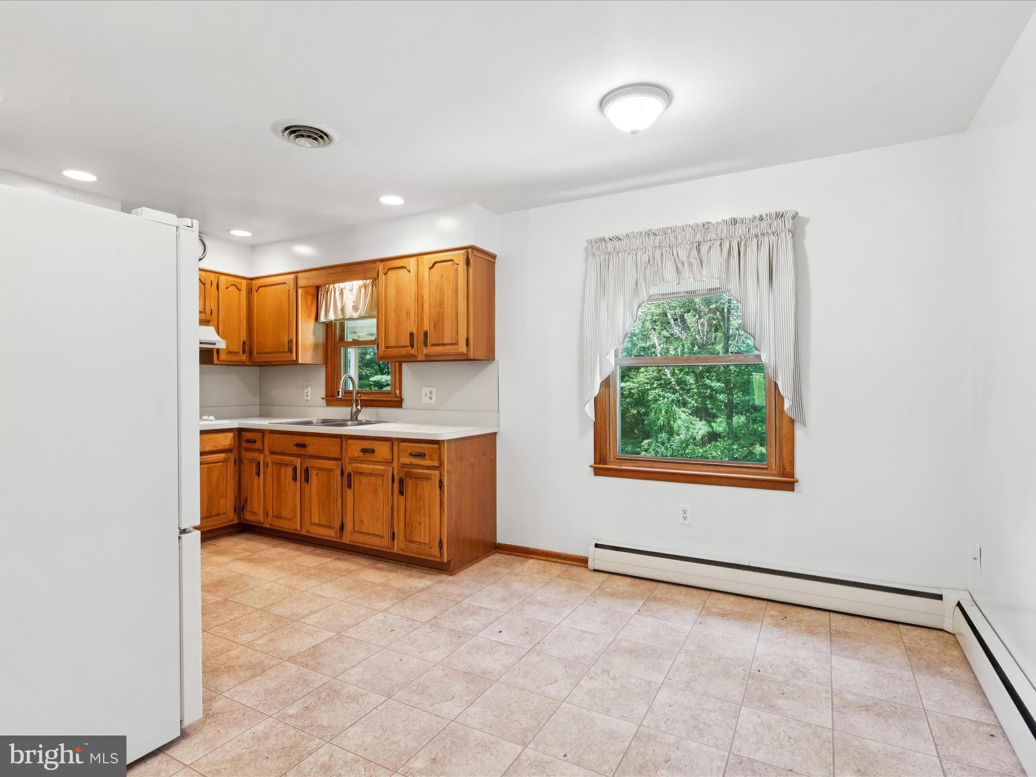 5149 Shookstown Road Frederick, MD 21702 - Photo 11 of 44 a bathroom with a tub sink and mirror