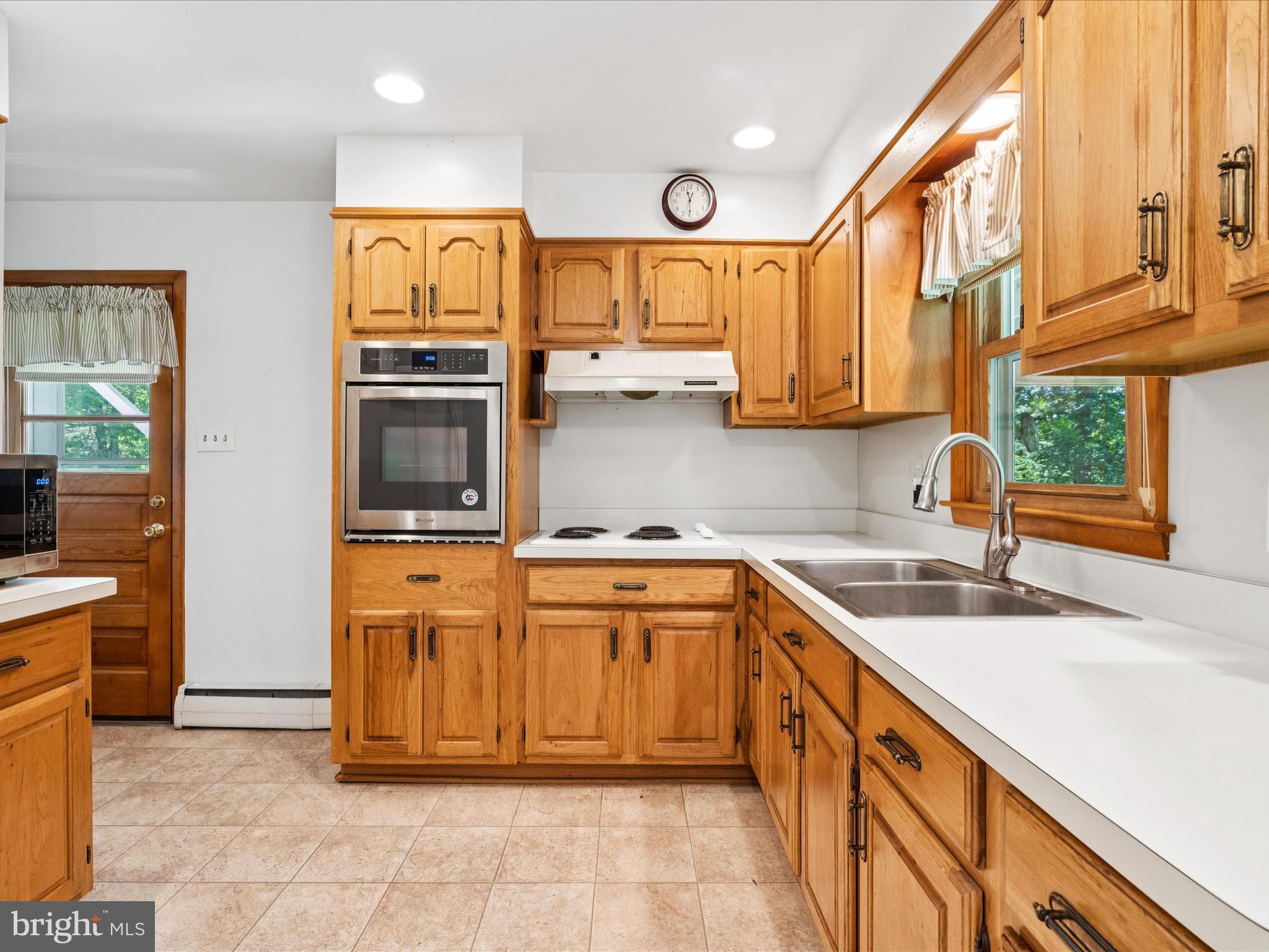 5149 Shookstown Road Frederick, MD 21702 - Photo 14 of 44 a kitchen with stainless steel appliances granite countertop a sink and a stove