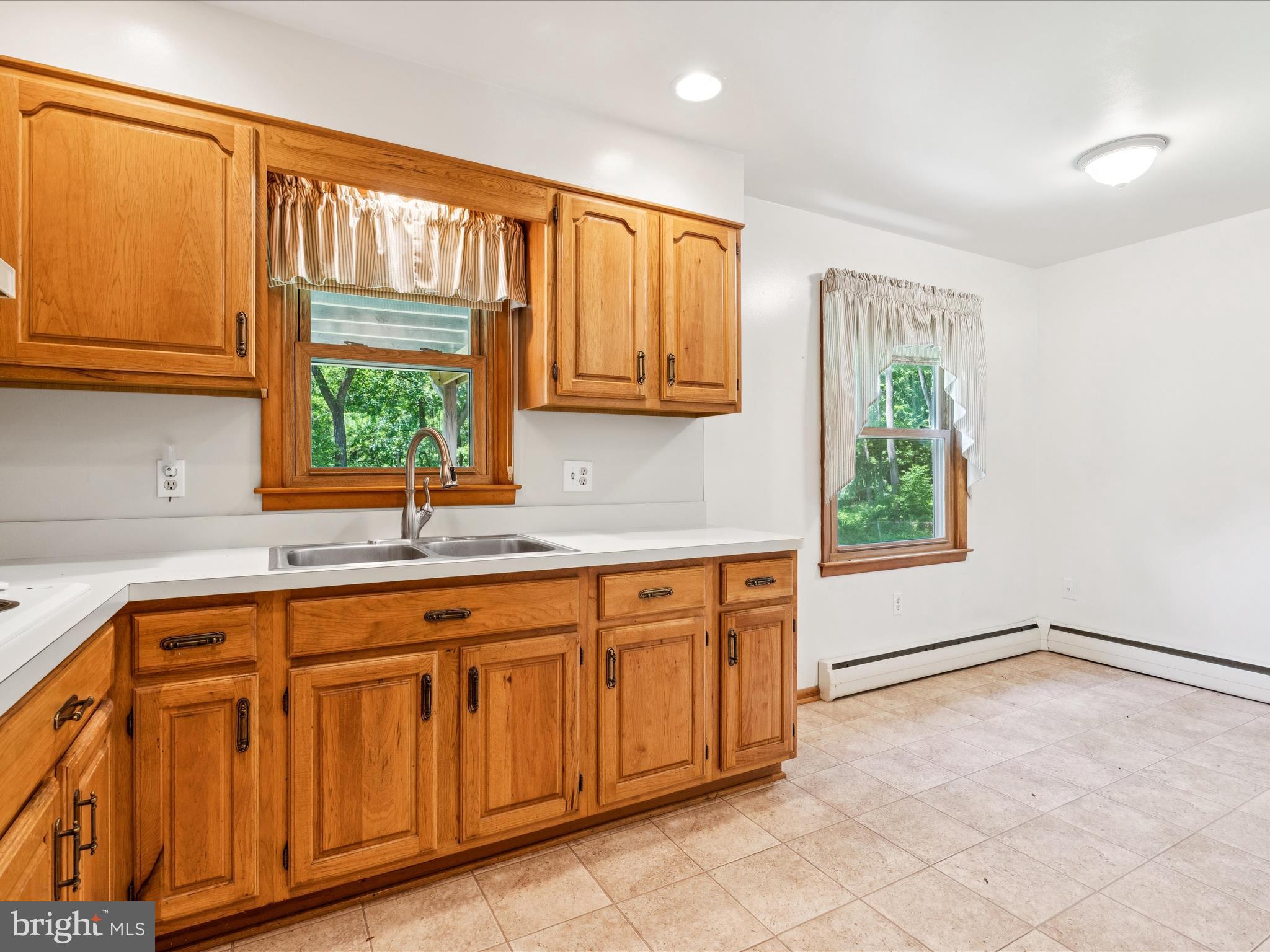 5149 Shookstown Road Frederick, MD 21702 - Photo 15 of 44 a kitchen with a sink window and cabinets