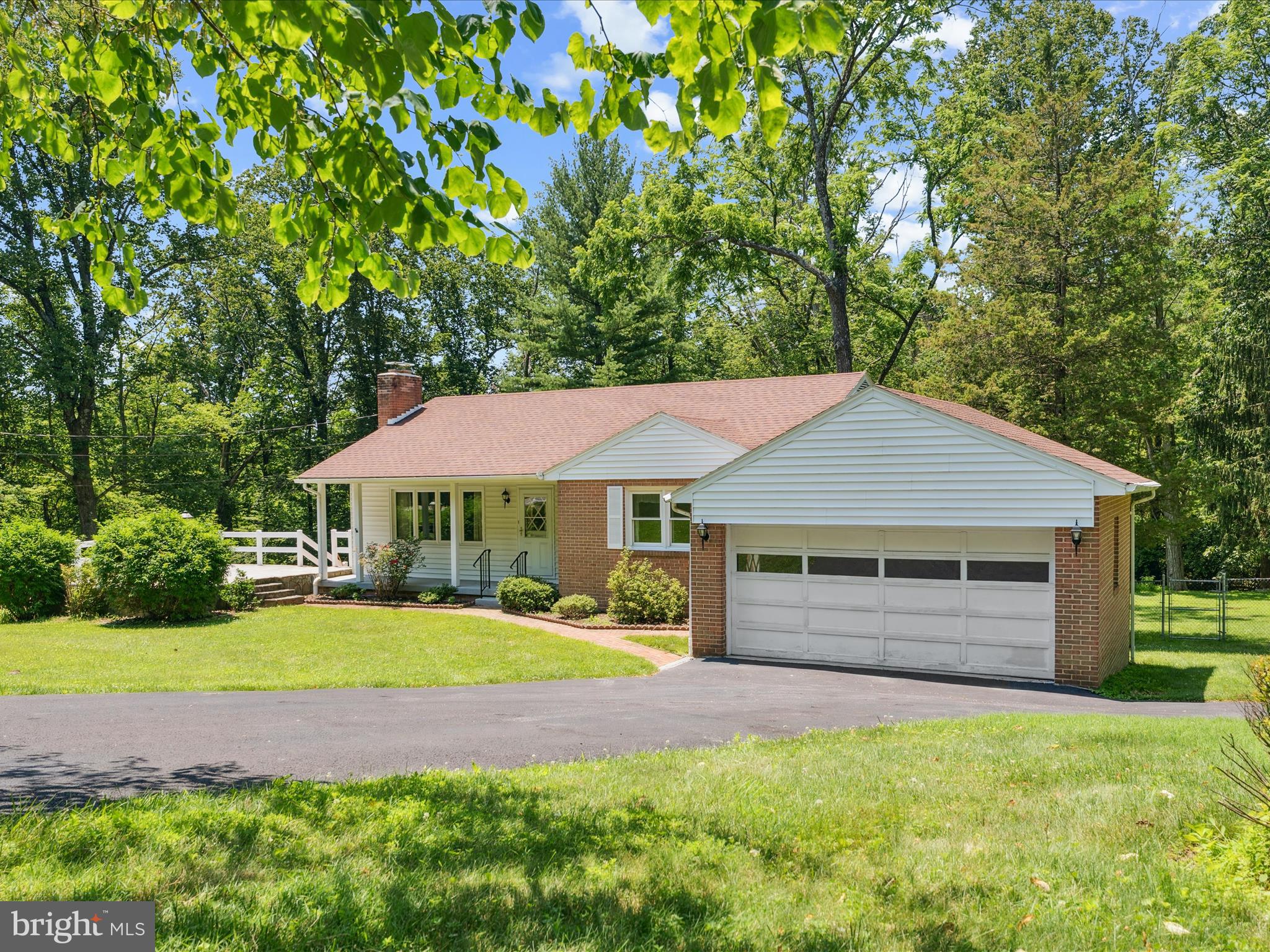 5149 Shookstown Road Frederick, MD 21702 - Photo 2 of 44 a backyard of a house with yard and outdoor seating