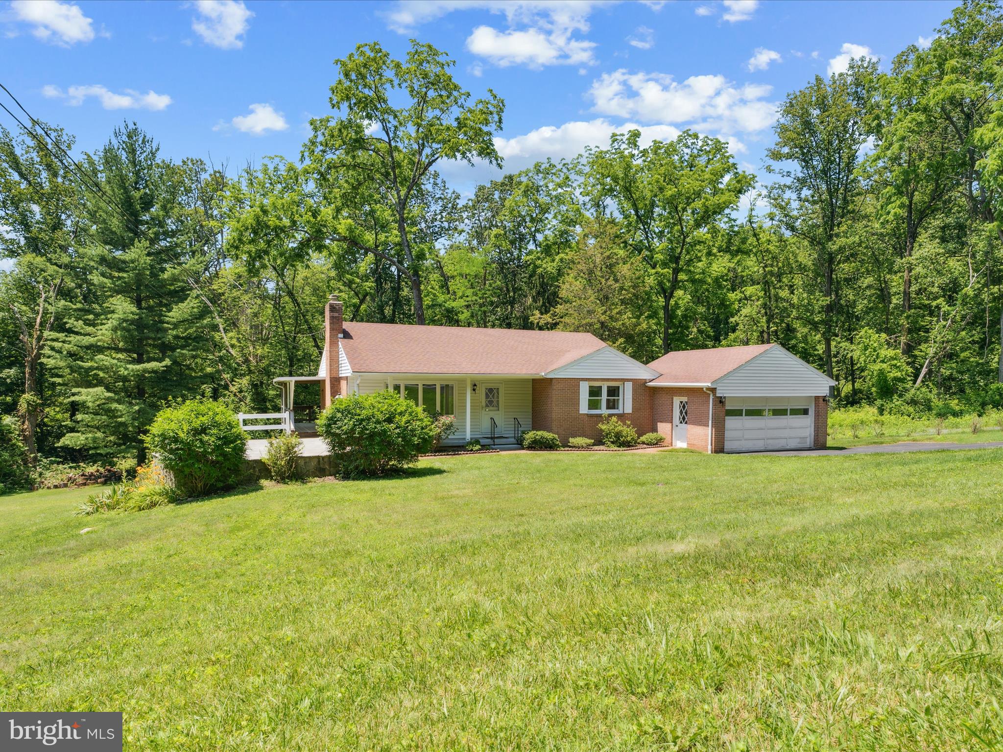 5149 Shookstown Road Frederick, MD 21702 - Photo 3 of 44 a front view of a house with a garden