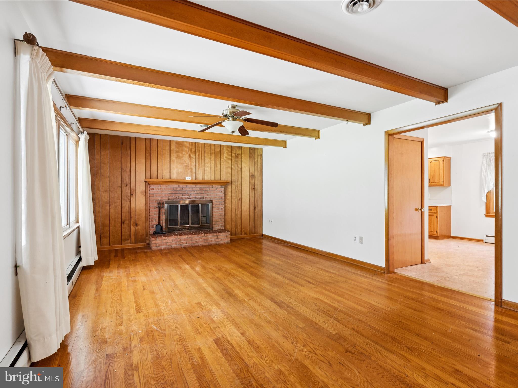 5149 Shookstown Road Frederick, MD 21702 - Photo 8 of 44 a view of an empty room and a fireplace