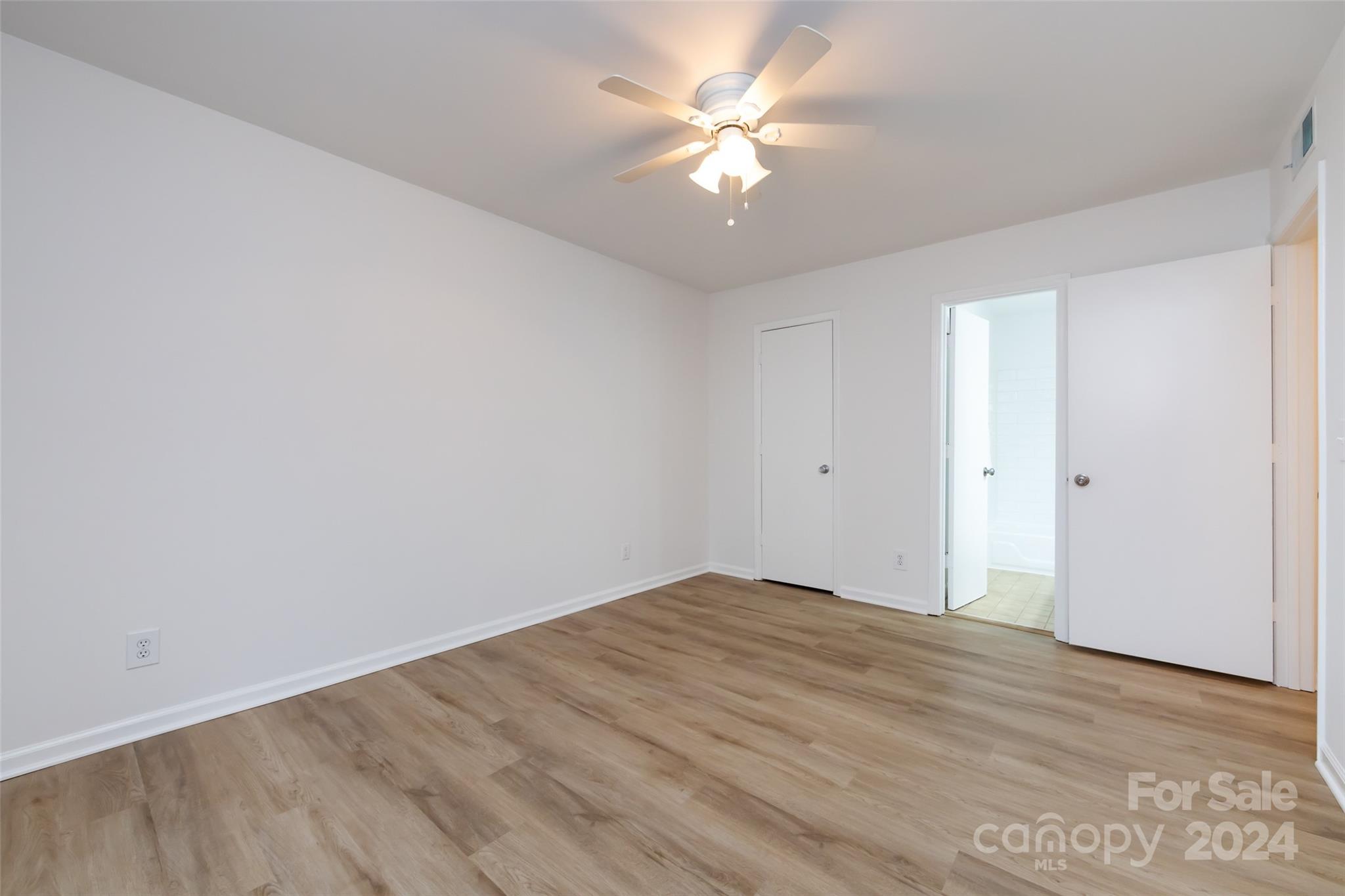430 Queens Road, Unit 231 Charlotte, NC 28207 - Photo 15 of 23 wooden floor in an empty room