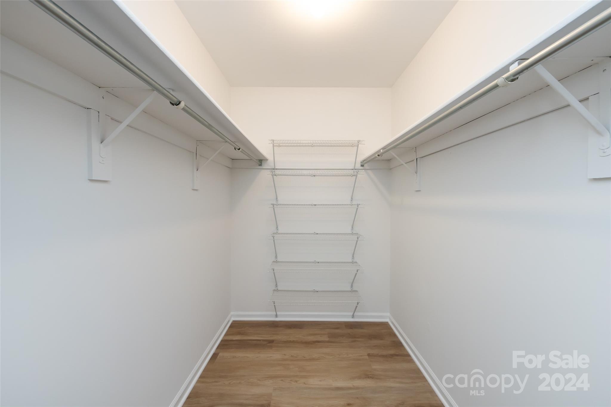 430 Queens Road, Unit 231 Charlotte, NC 28207 - Photo 16 of 23 a view of a room with walk in closet
