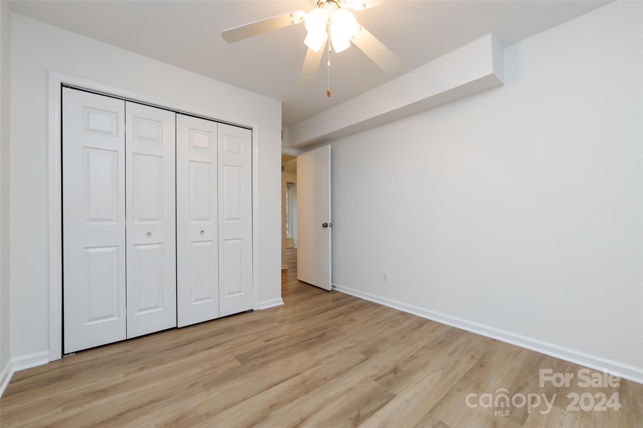 430 Queens Road, Unit 231 Charlotte, NC 28207 - Photo 20 of 23 wooden floor in an empty room