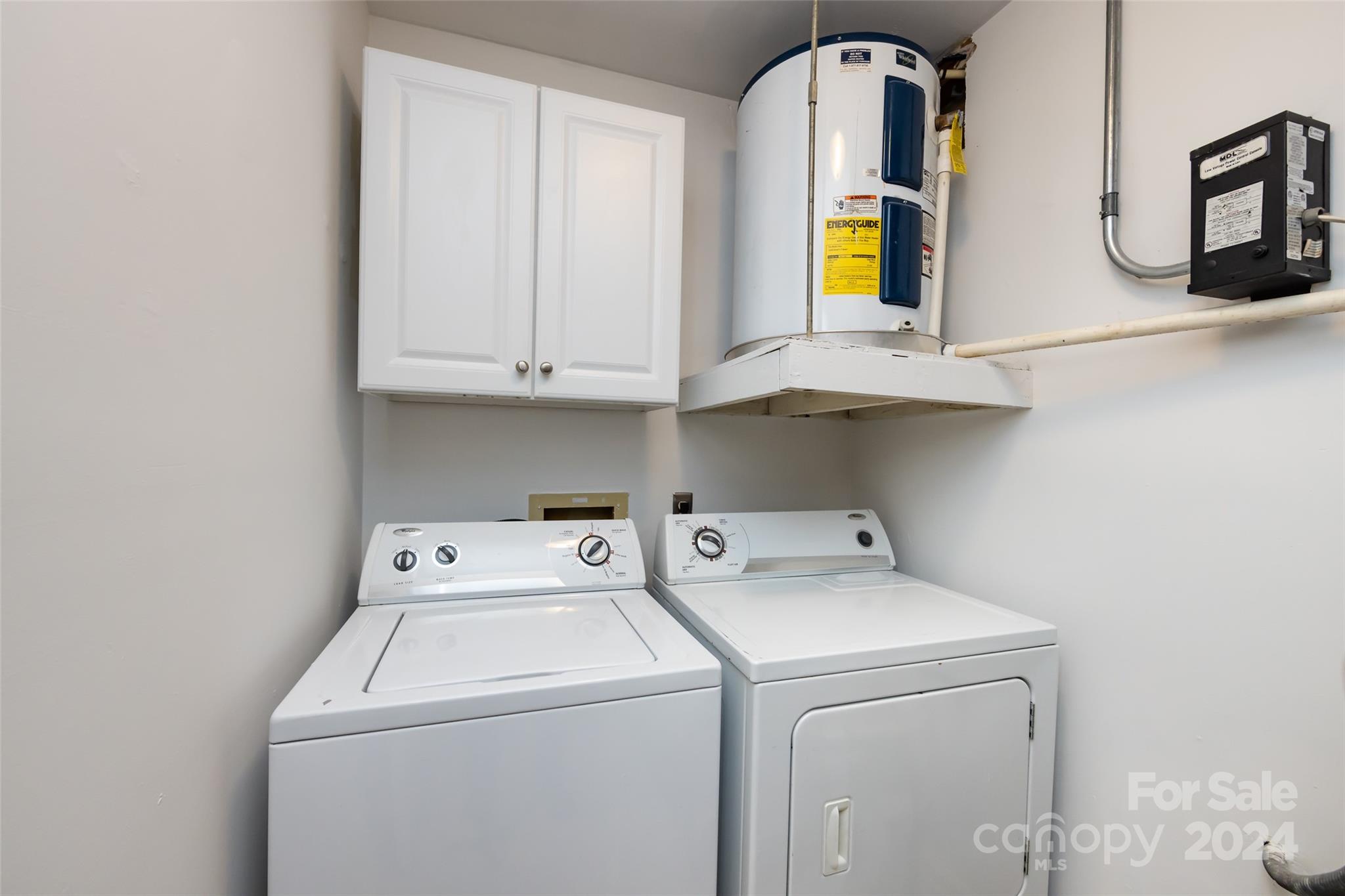 430 Queens Road, Unit 231 Charlotte, NC 28207 - Photo 22 of 23 a utility room with dryer and washer