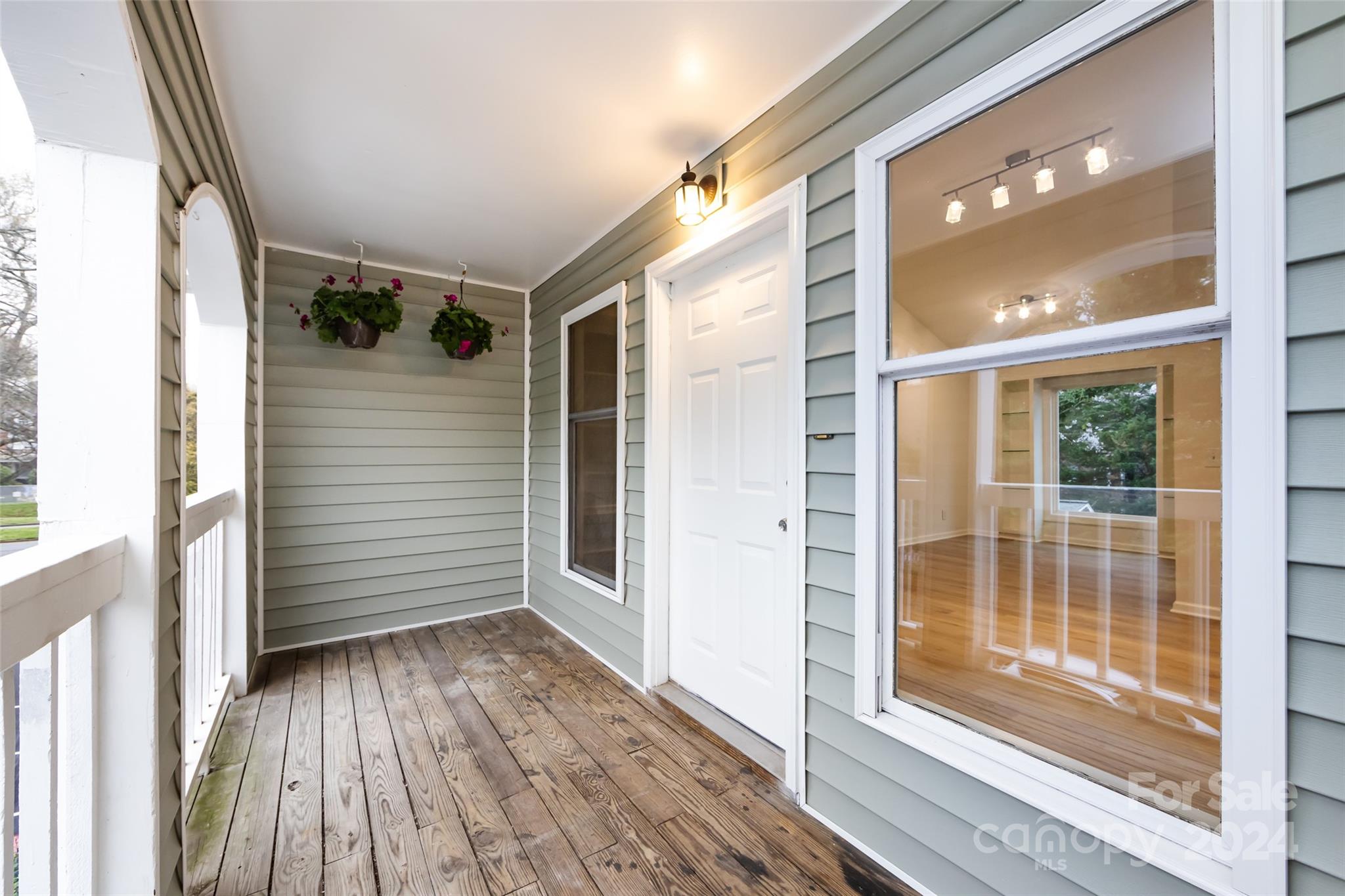 430 Queens Road, Unit 231 Charlotte, NC 28207 - Photo 3 of 23 a view of front door and deck of the house
