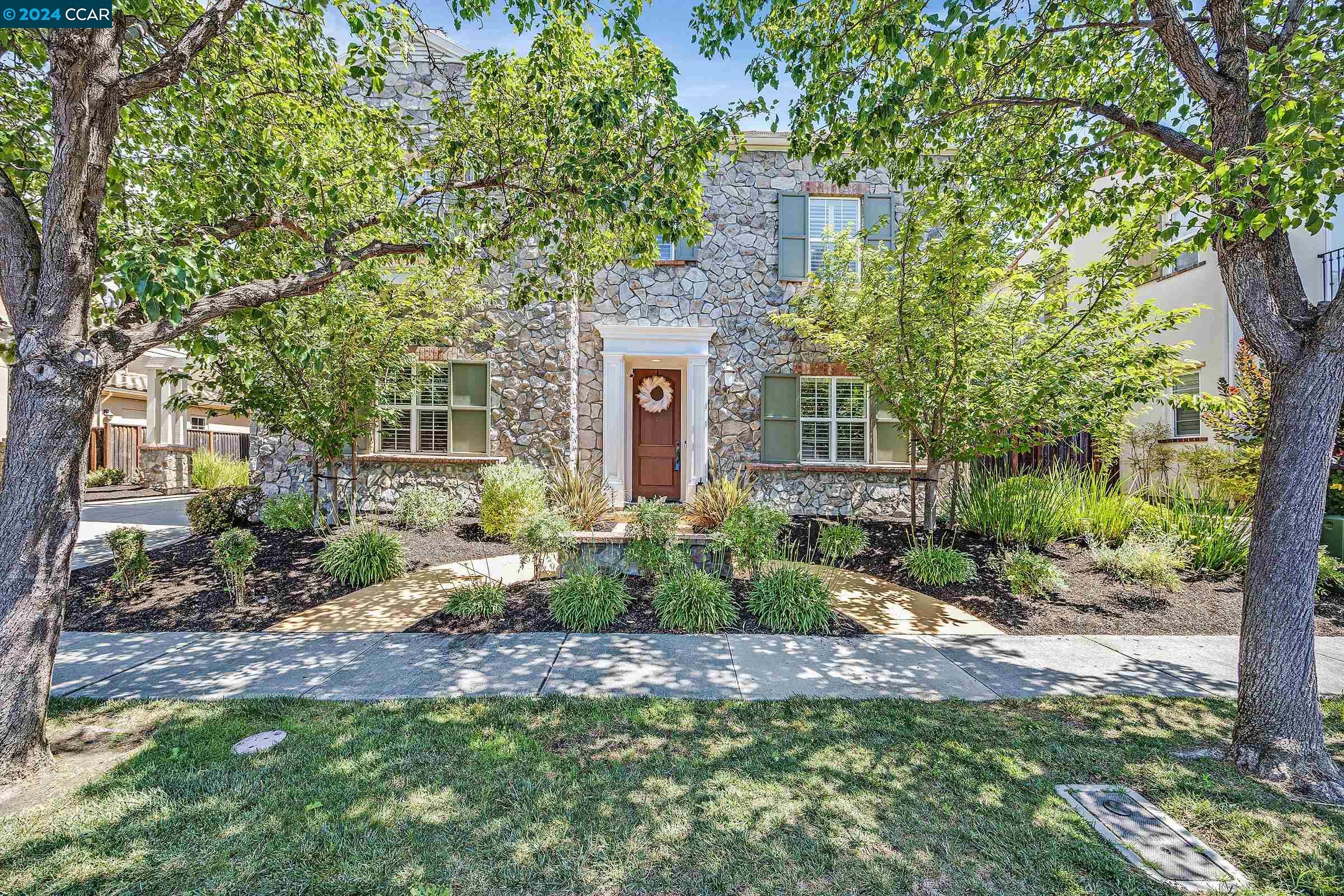 front view of a house with a yard