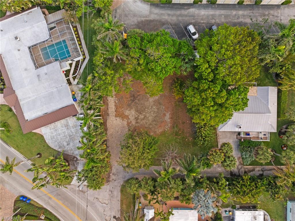 1205 Sandpiper Street Naples, FL 34102 - Photo 4 of 8 an aerial view of a house with a yard