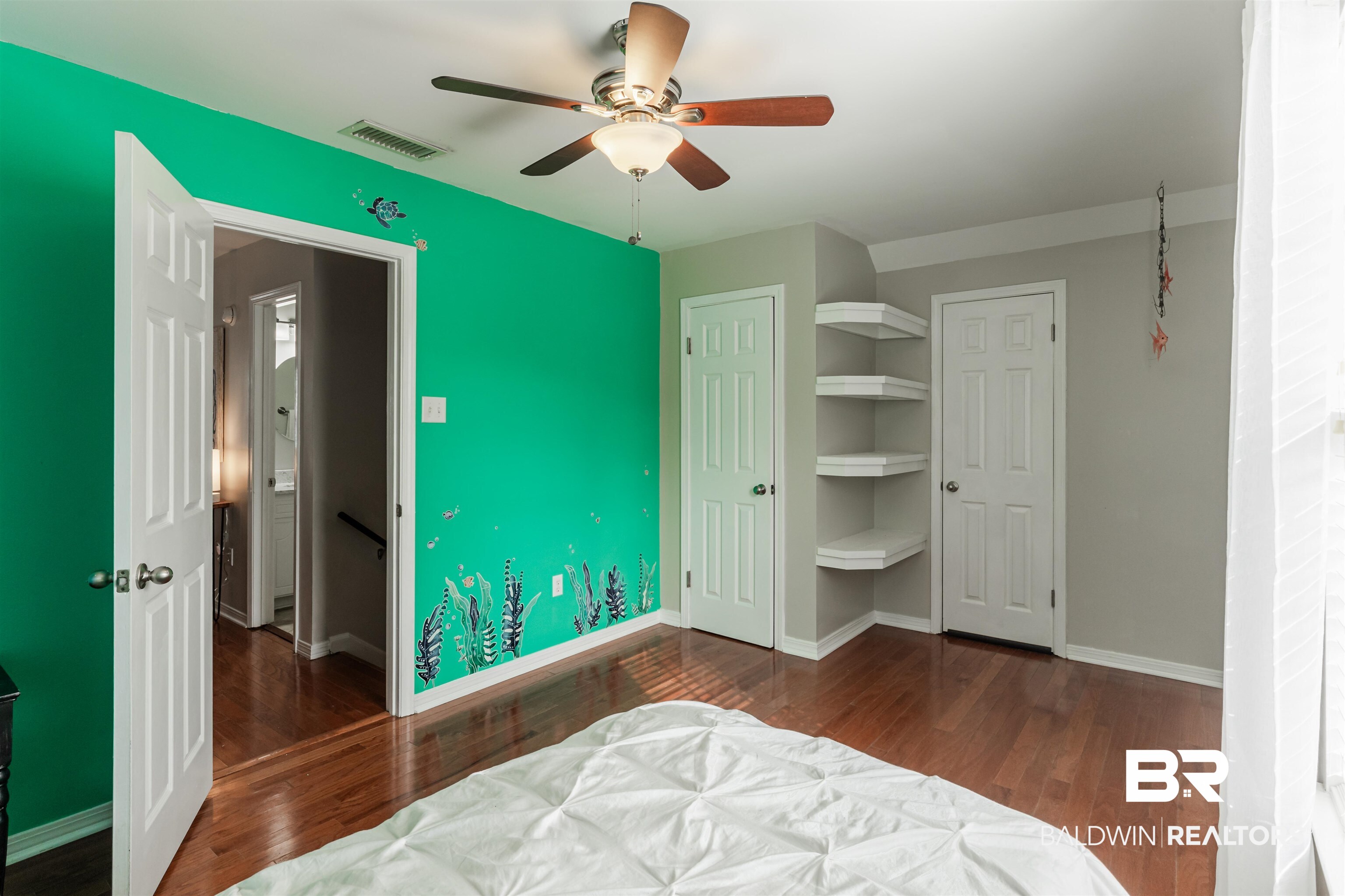 3844 Isabel Way South Mobile, AL 36693 - Photo 41 of 49 Bedroom with ceiling fan, dark hardwood / wood-style flooring, and a closet