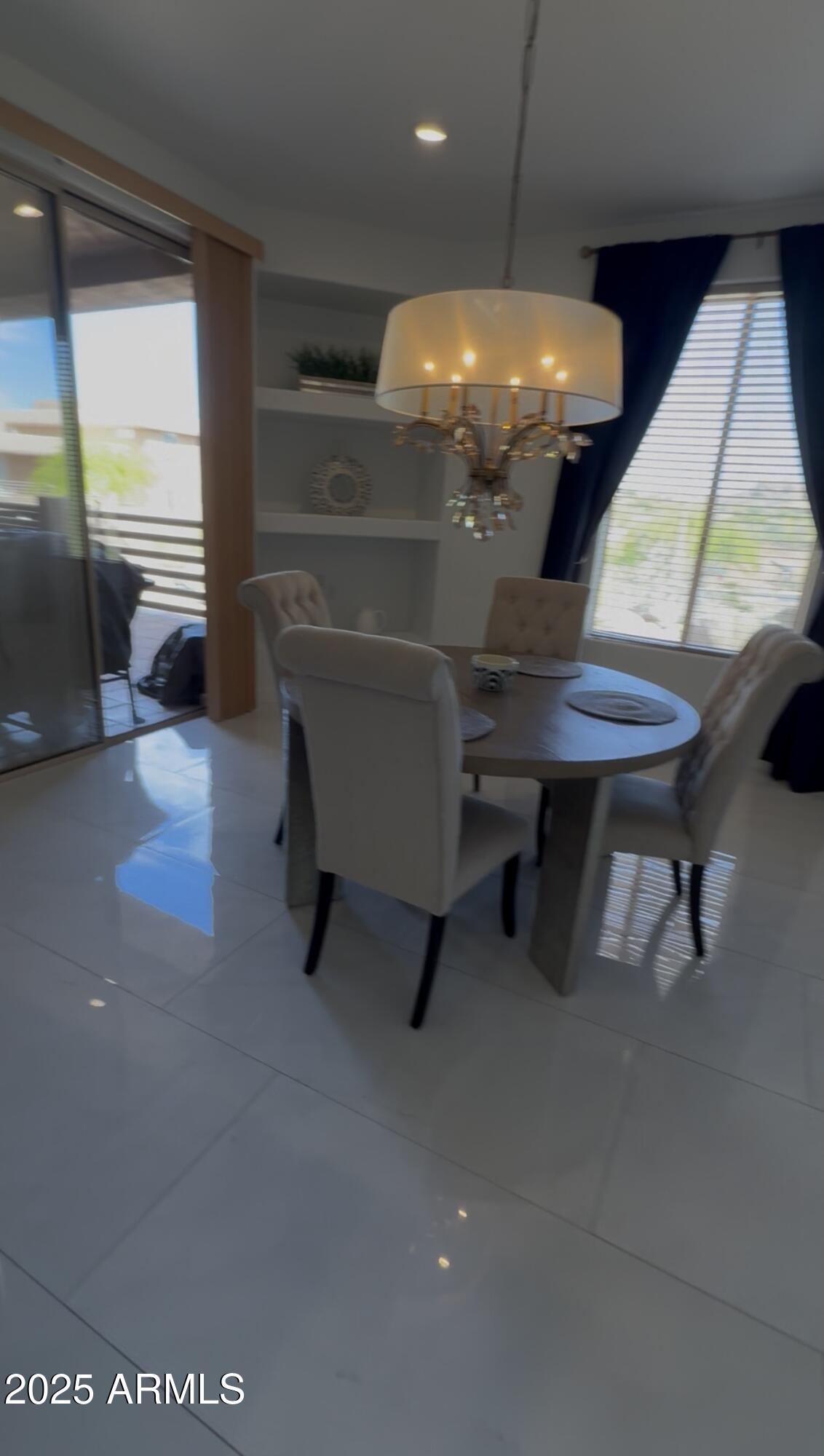 10222 East Southwind Lane, Unit 1009 Scottsdale, AZ 85262 - Photo 11 of 44 a room with table and chairs