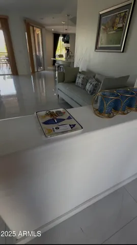 a view of a livingroom with furniture and a flat screen tv