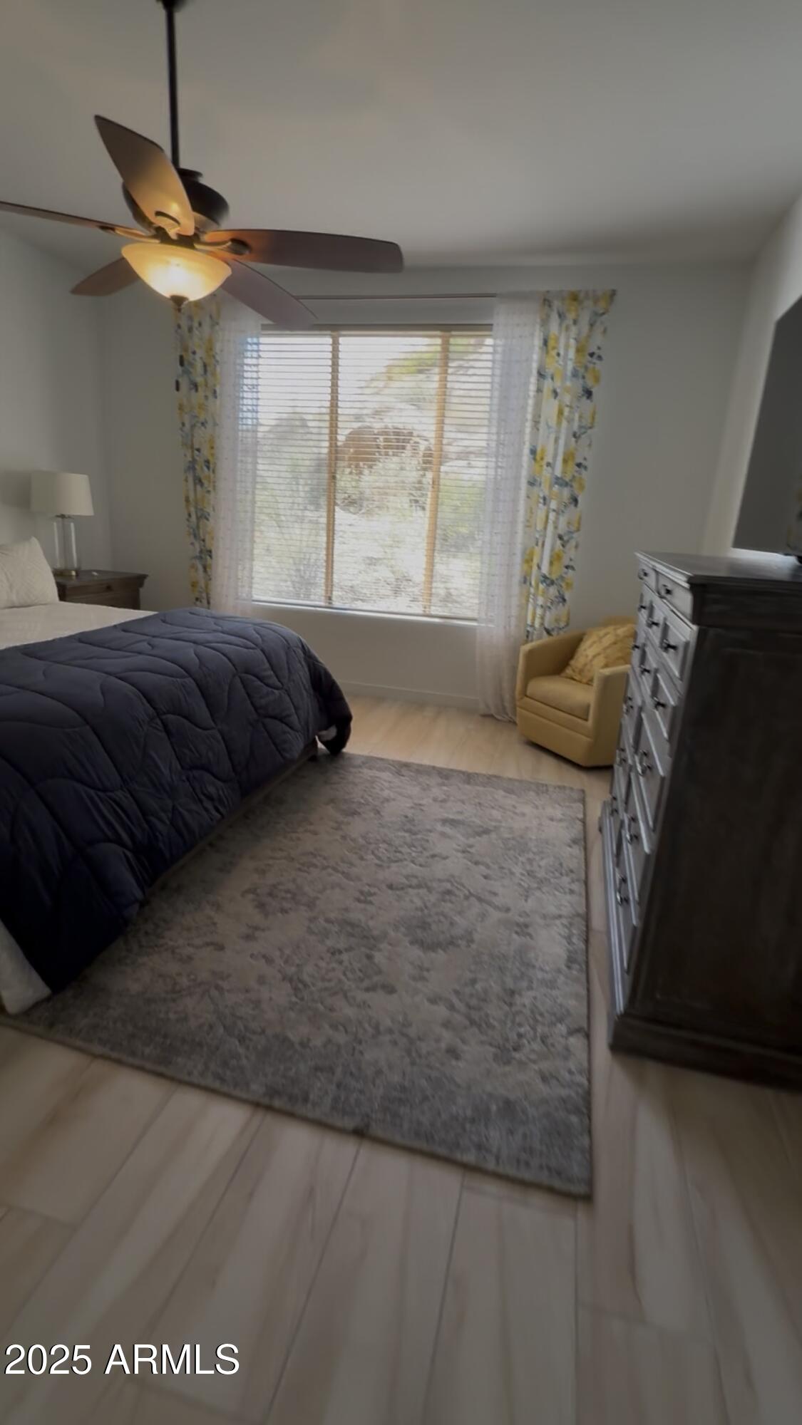 10222 East Southwind Lane, Unit 1009 Scottsdale, AZ 85262 - Photo 21 of 44 a bedroom with a bed and window