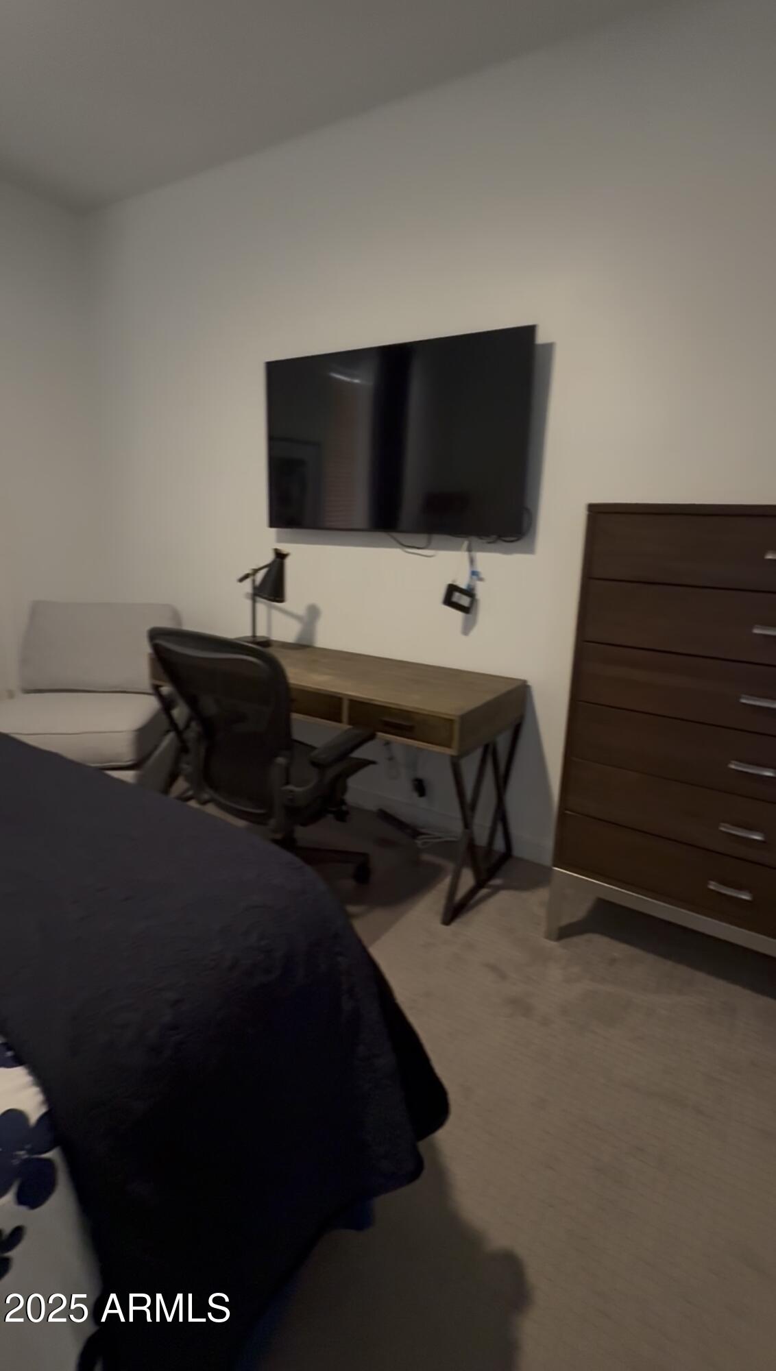 10222 East Southwind Lane, Unit 1009 Scottsdale, AZ 85262 - Photo 29 of 44 a living room with furniture and a flat screen tv