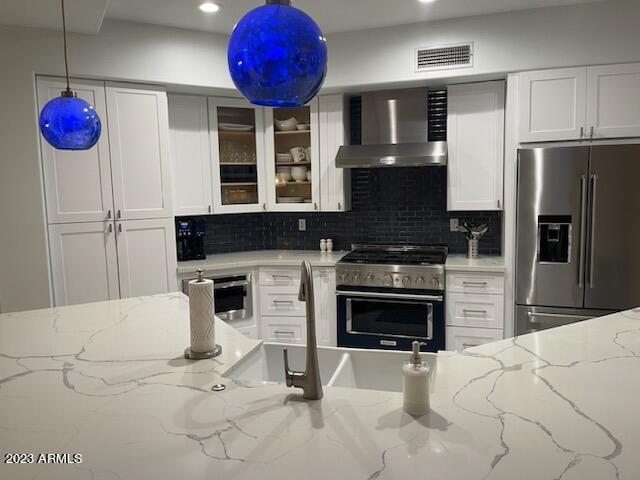 10222 East Southwind Lane, Unit 1009 Scottsdale, AZ 85262 - Photo 3 of 44 a kitchen with a refrigerator oven and a fireplace