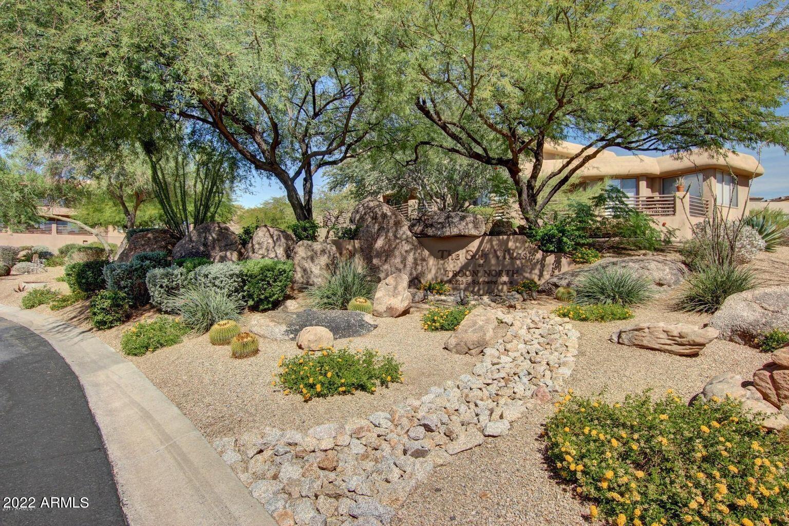 10222 East Southwind Lane, Unit 1009 Scottsdale, AZ 85262 - Photo 32 of 44 a view of a garden with a pathway