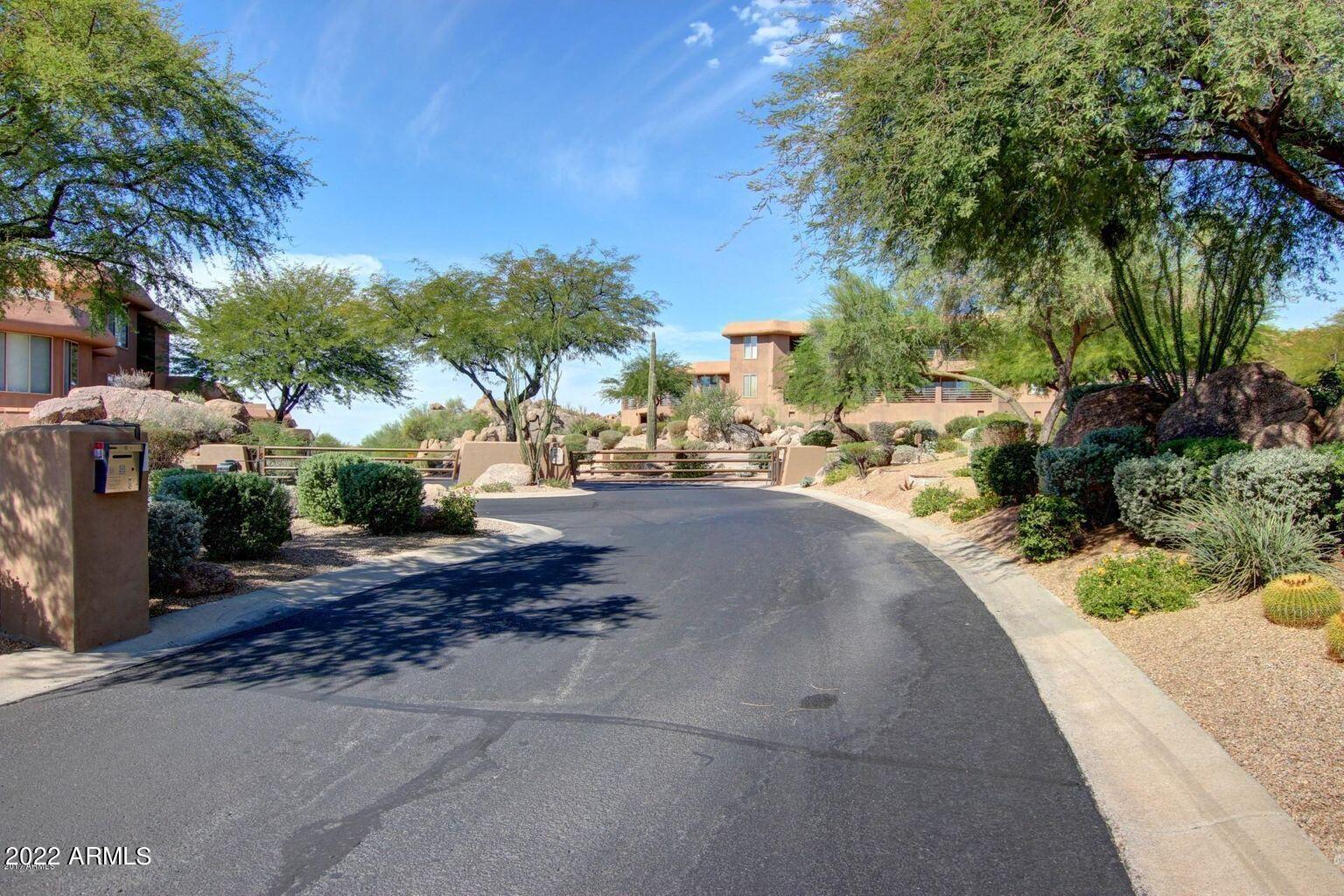 10222 East Southwind Lane, Unit 1009 Scottsdale, AZ 85262 - Photo 33 of 44 a view of a backyard of the house
