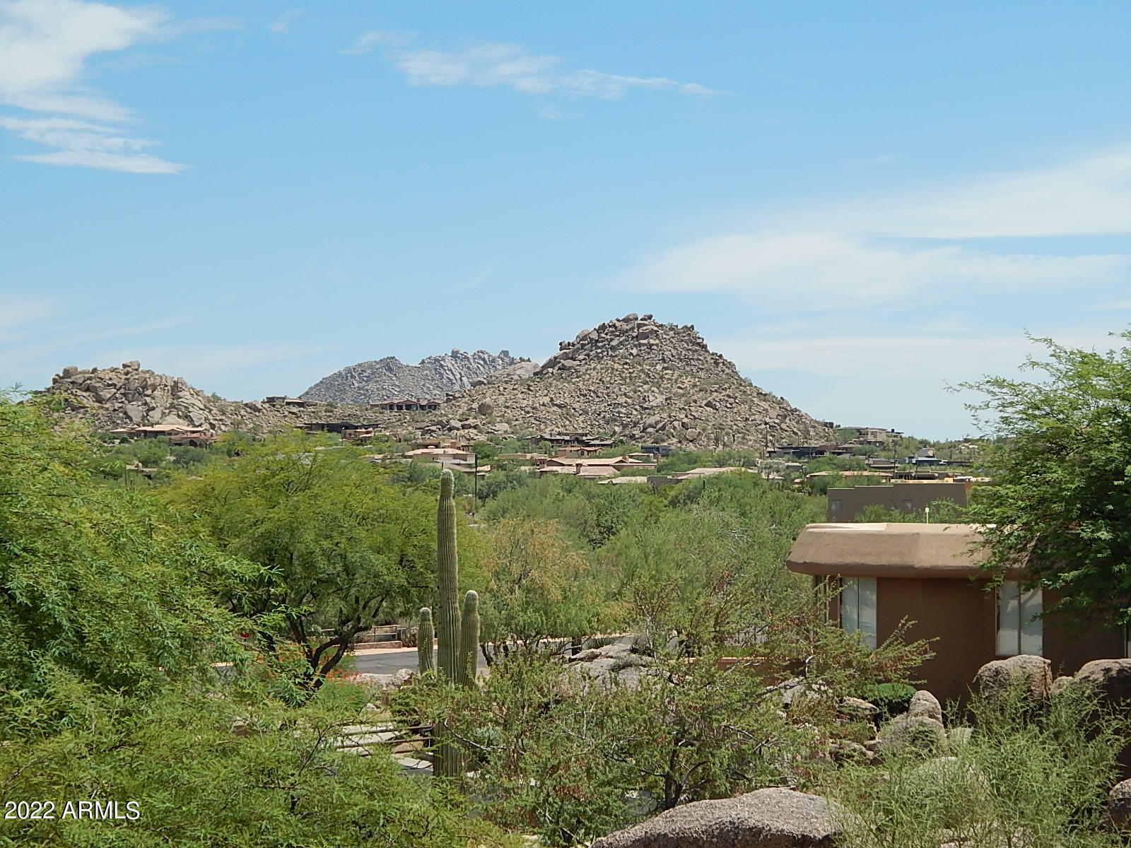 10222 East Southwind Lane, Unit 1009 Scottsdale, AZ 85262 - Photo 35 of 44 a view of a lake with a mountain in the background
