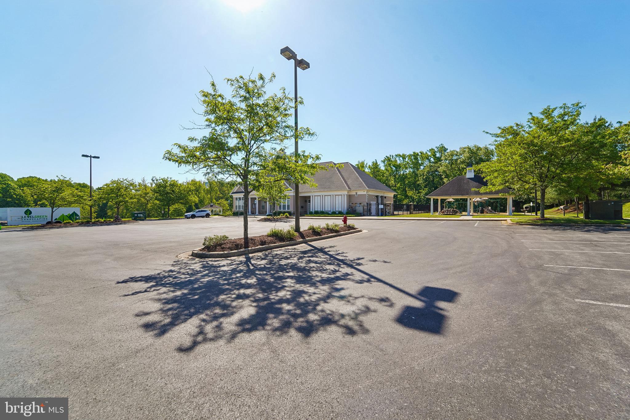 1461 Pangbourne Way Hanover, MD 21076 - Photo 41 of 51 a view of a road with a bench and trees
