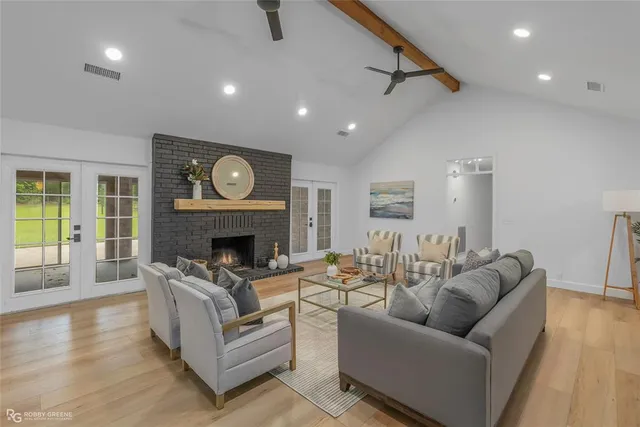a living room with furniture and a fireplace