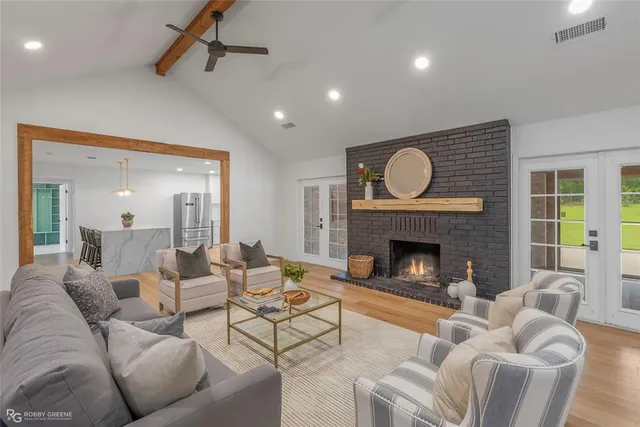 a living room with furniture and a fireplace
