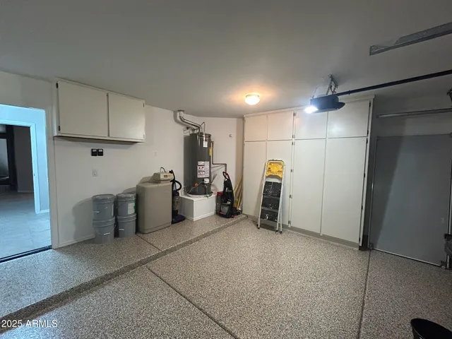 a view of a storage & utility room with lots of appliances
