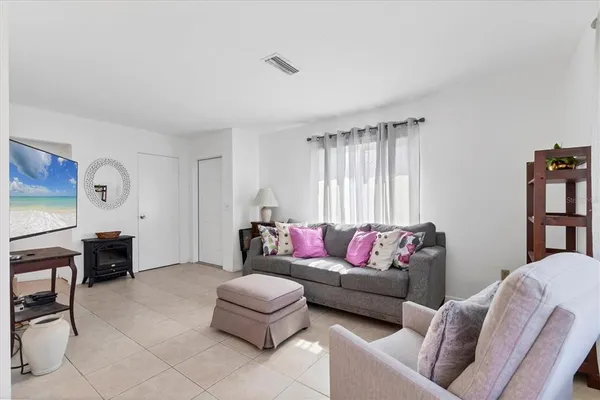 a living room with furniture and a window
