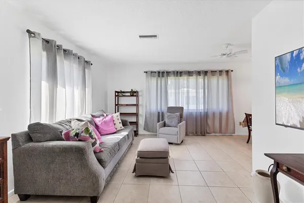 a living room with furniture and a large window
