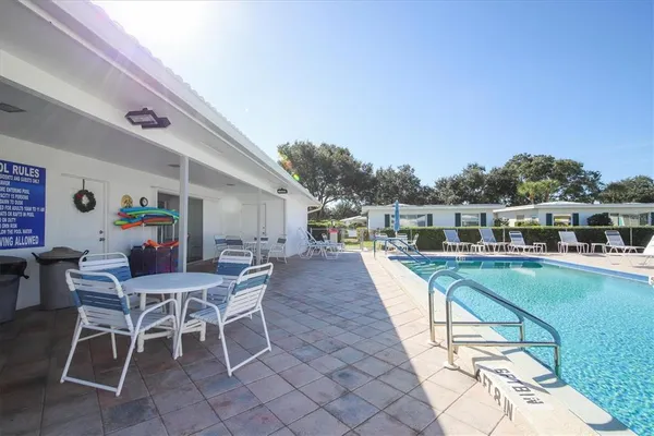 a view of a swimming pool and lounge chair