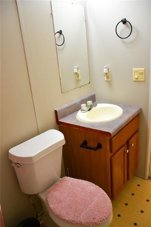 13396 Highway 53 Fairmount, GA 30139 - Photo 6 of 20 a bathroom with a sink toilet and mirror
