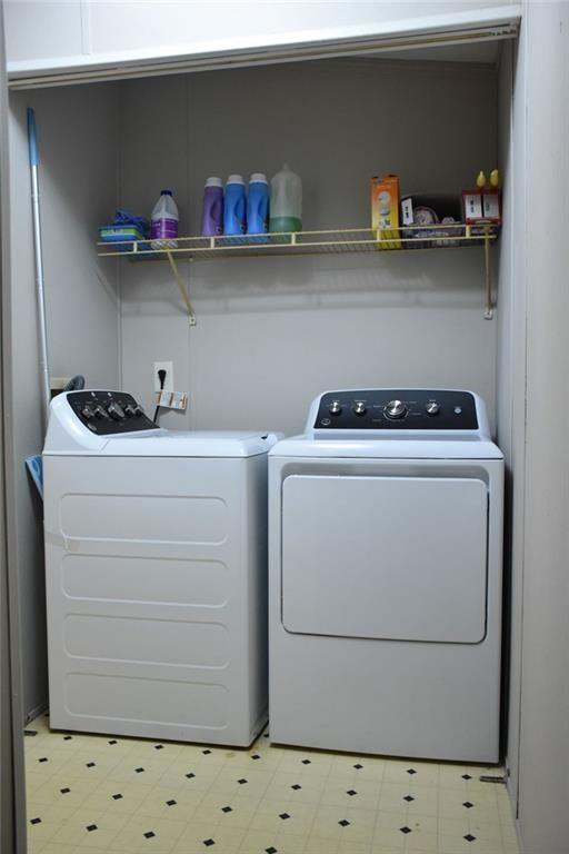 13396 Highway 53 Fairmount, GA 30139 - Photo 8 of 20 a utility room with sink dryer and cabinets