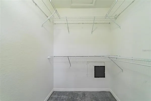 a view of a room with racks on the wall