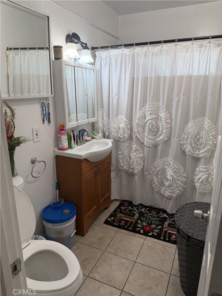 12940 Prairie Avenue Hawthorne, CA 90250 - Photo 12 of 17 a bathroom with a sink toilet and shower