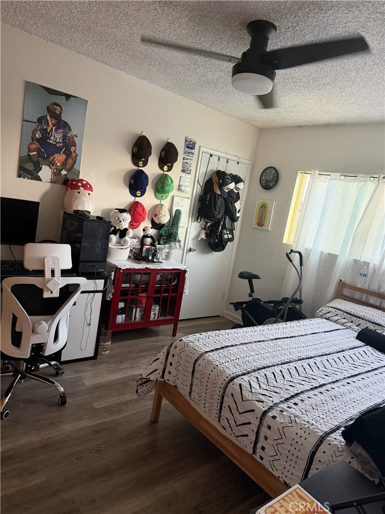 12940 Prairie Avenue Hawthorne, CA 90250 - Photo 13 of 17 a bedroom with a bed and a chandelier