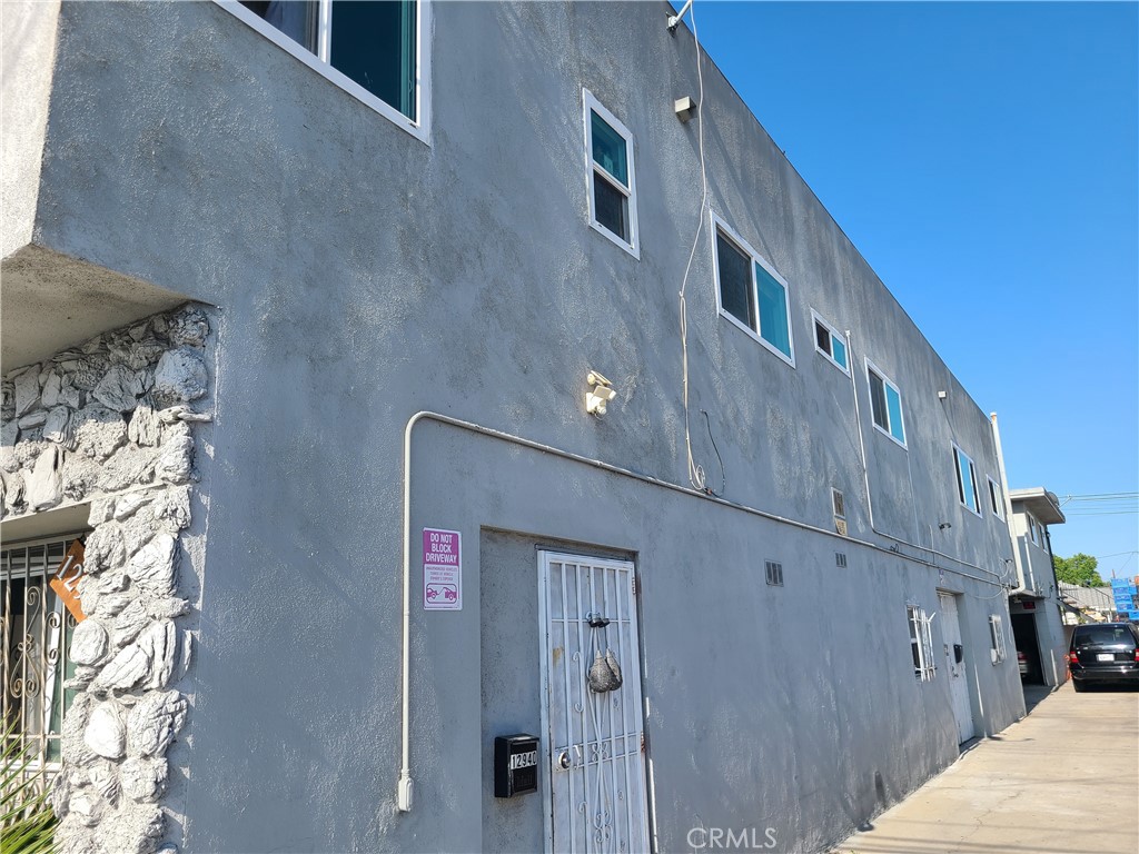 12940 Prairie Avenue Hawthorne, CA 90250 - Photo 5 of 17 a front view of a house with iron stairs
