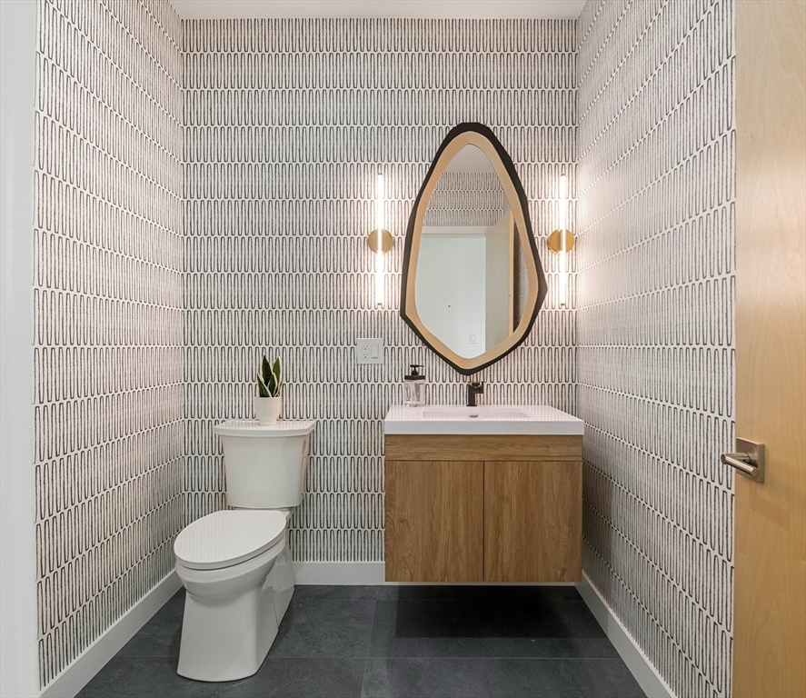 23 Deerhaven Road Lincoln, MA 01773 - Photo 16 of 39 a bathroom with a toilet sink and mirror