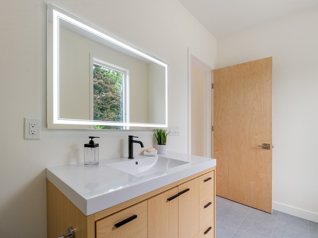 23 Deerhaven Road Lincoln, MA 01773 - Photo 19 of 39 a bathroom with a sink and a mirror
