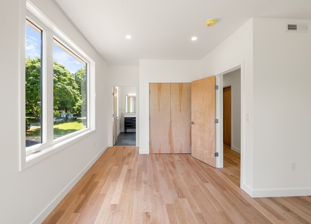 23 Deerhaven Road Lincoln, MA 01773 - Photo 28 of 39 a view of hallway with a large window and wooden floor