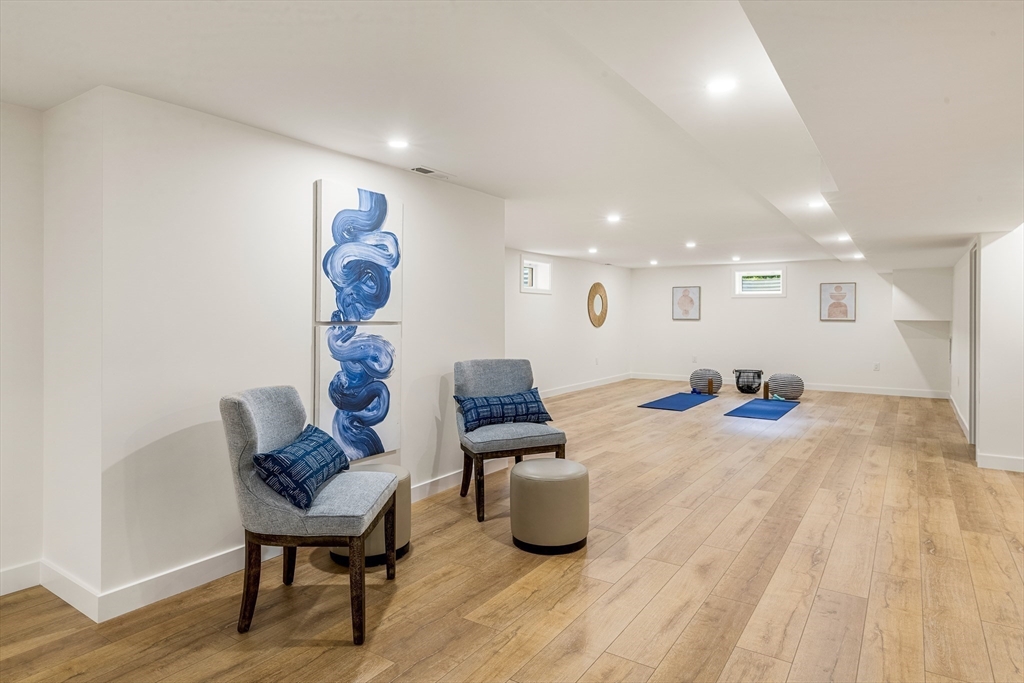 23 Deerhaven Road Lincoln, MA 01773 - Photo 36 of 39 a living room with furniture and a wooden floor
