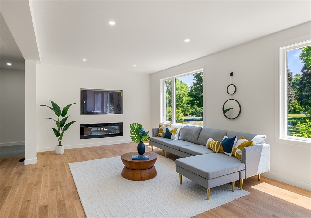 23 Deerhaven Road Lincoln, MA 01773 - Photo 8 of 39 a living room with furniture a window and potted plants