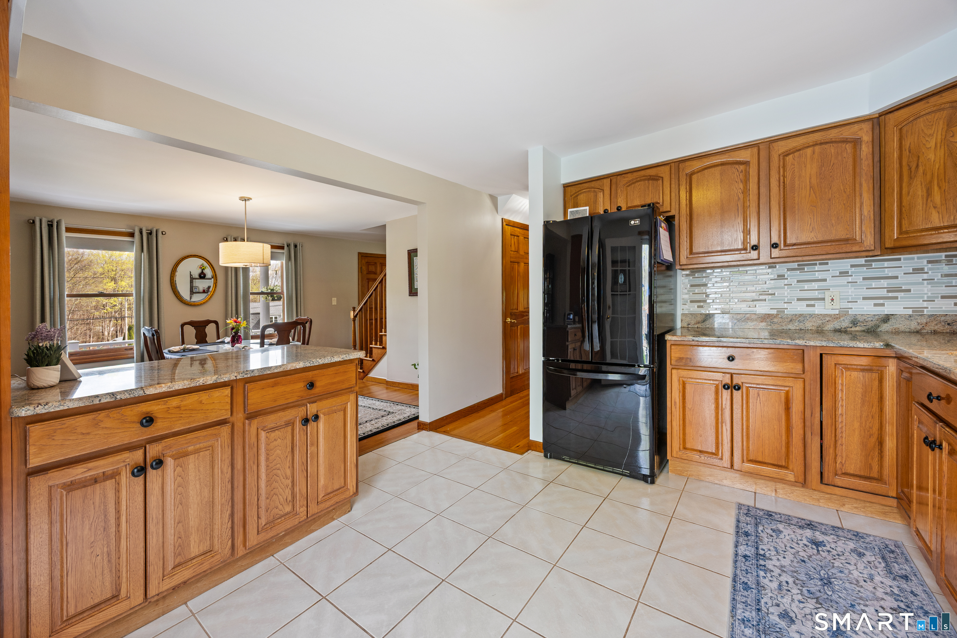 42 Chimney Sweep Road Wallingford, CT 06492 - Photo 40 of 40 a large kitchen with stainless steel appliances granite countertop a refrigerator and a sink