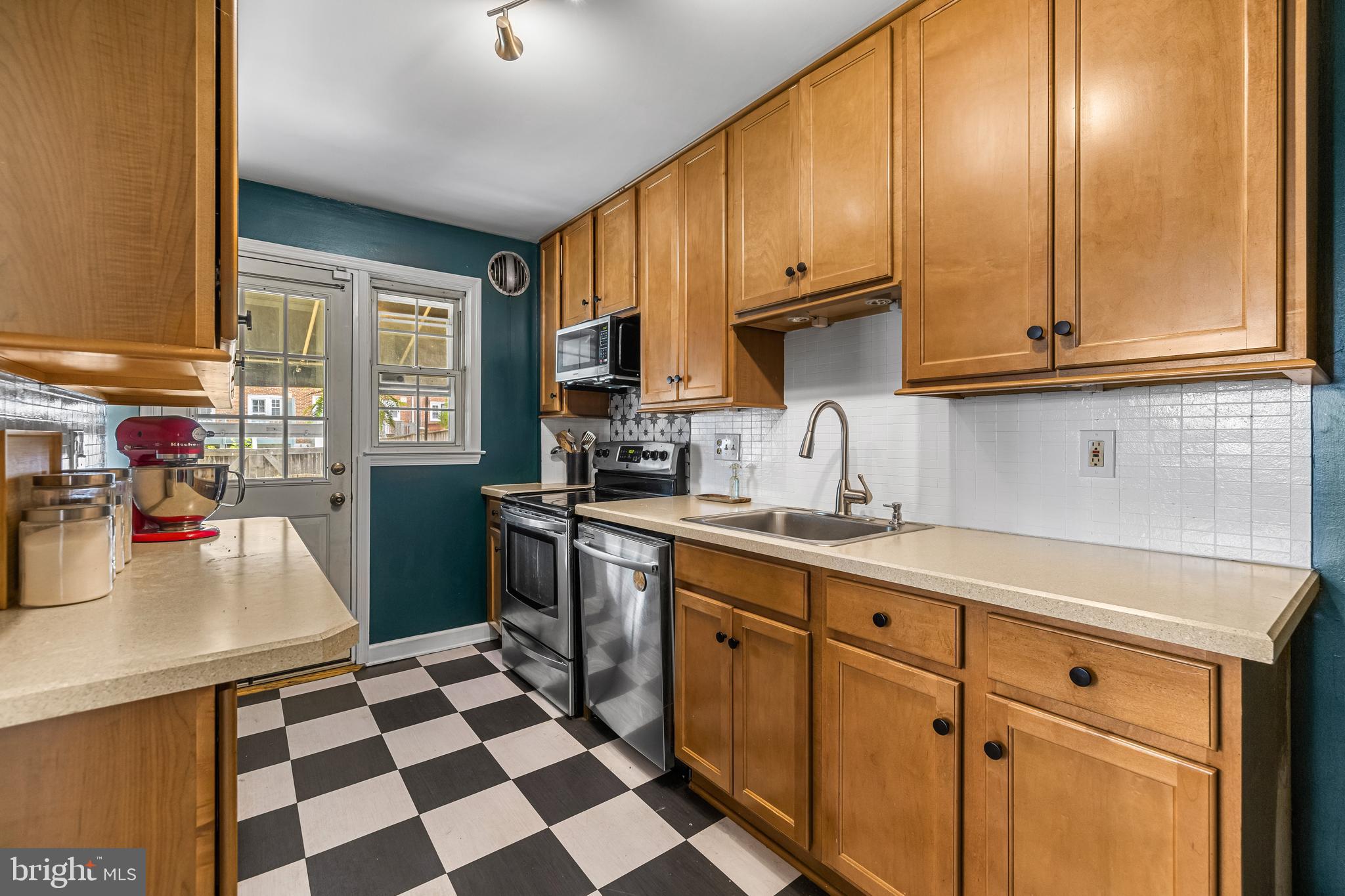 1620 Hardwick Road Towson, MD 21286 - Photo 12 of 38 a kitchen with stainless steel appliances granite countertop a sink stove and cabinets