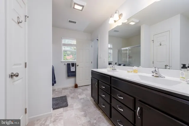 a bathroom with a shower sink and toilet