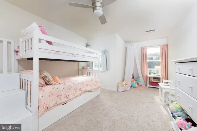 a bedroom with a bed and cabinets