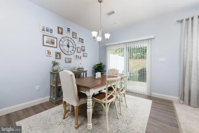 a kitchen with granite countertop stainless steel appliances cabinets a sink and a counter top space