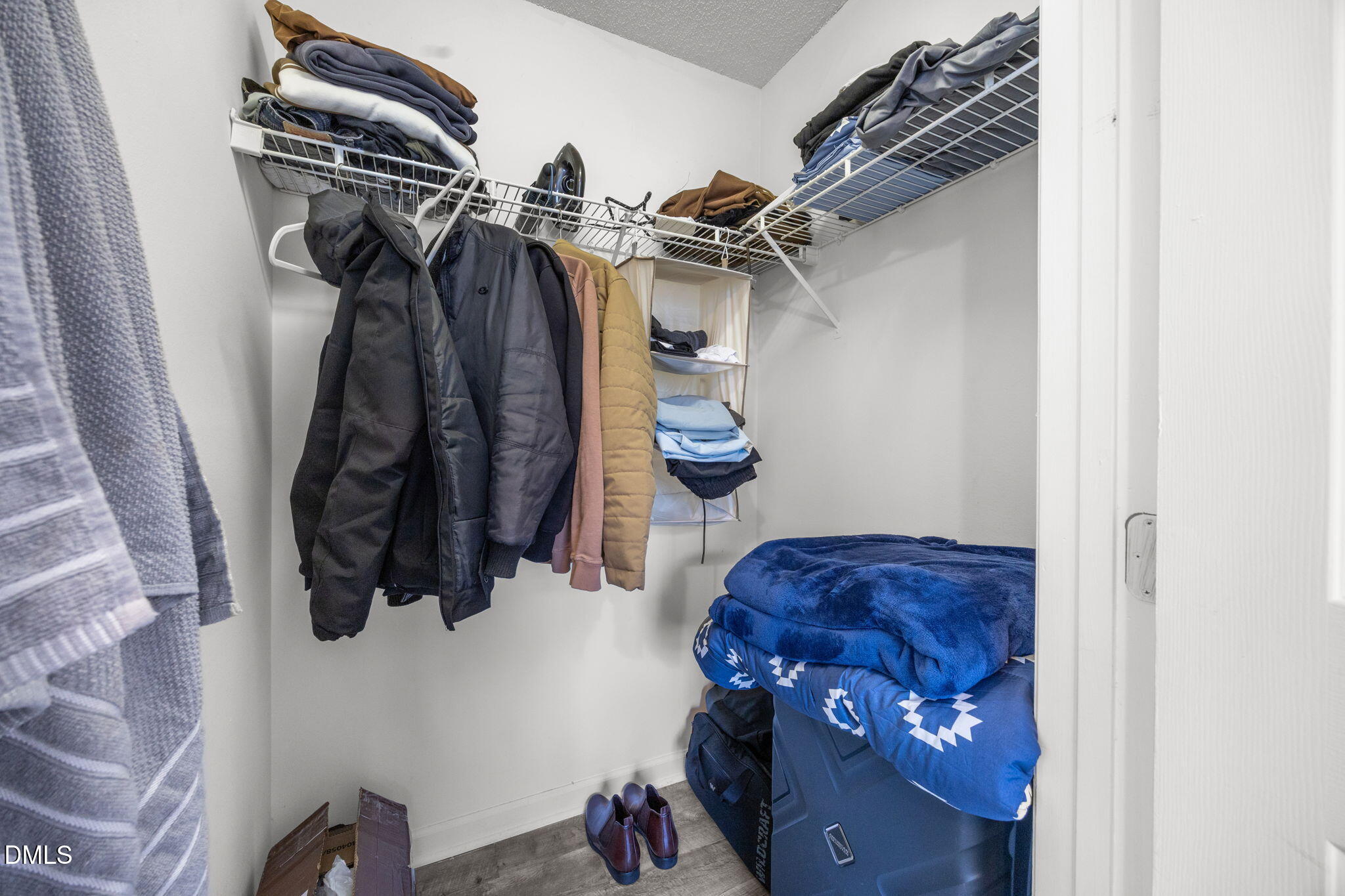 1305 Kent Road, Unit 101 Raleigh, NC 27606 - Photo 13 of 29 a view of walk in closet with clothes and shoes