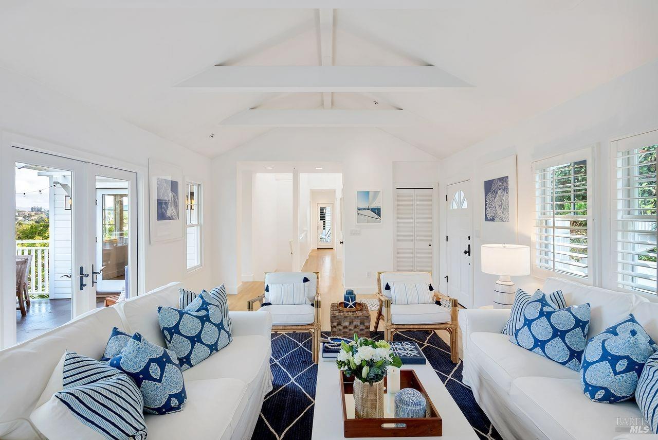 a living room with furniture chess table and a window