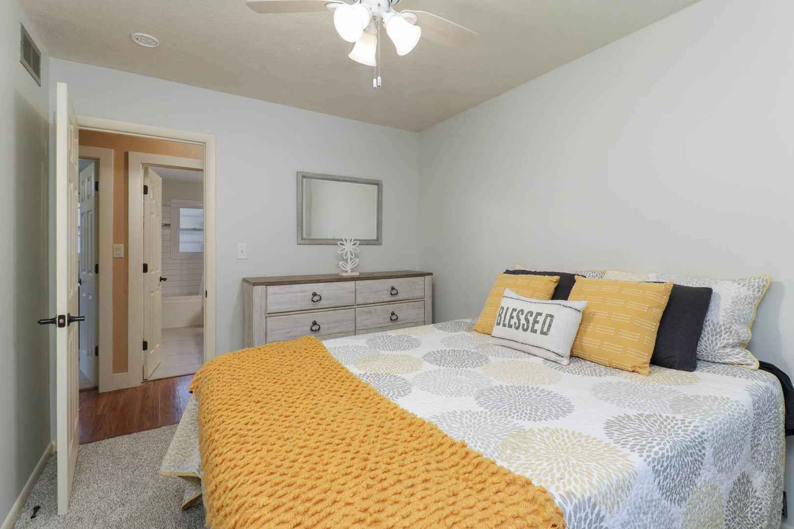 1222 Jersey Avenue Normal, IL 61761 - Photo 22 of 41 a bedroom with a bed and a chandelier