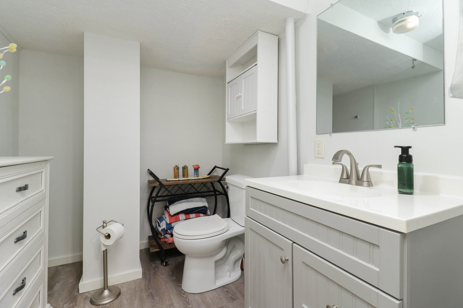 1222 Jersey Avenue Normal, IL 61761 - Photo 28 of 41 a white toilet sitting next to a bathroom sink