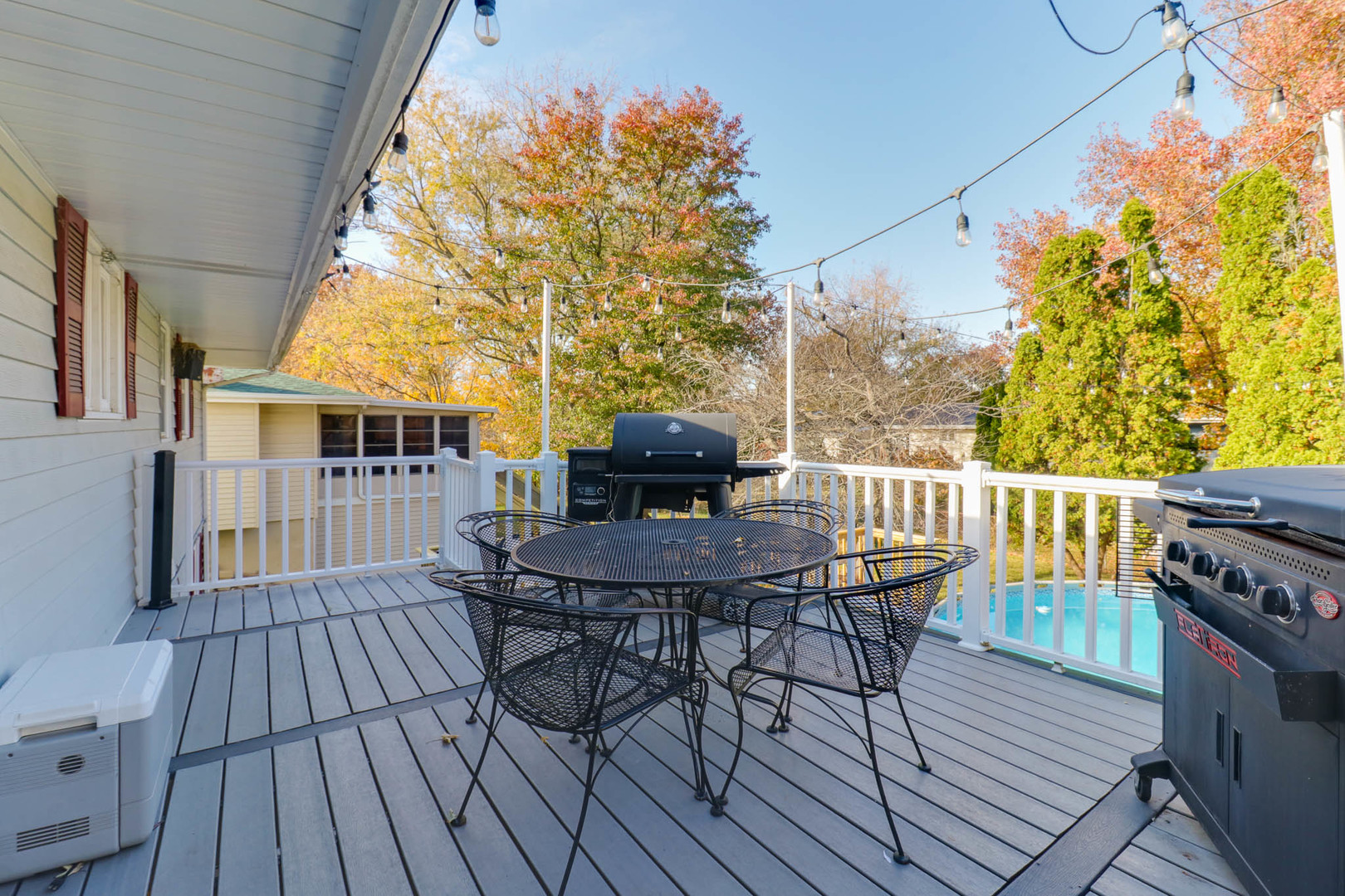 1222 Jersey Avenue Normal, IL 61761 - Photo 34 of 41 a view of a deck with table and chairs and wooden floor